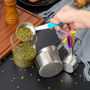 Stainless steel measuring cups and spoons set with colorful silicone handles for baking.