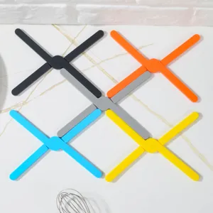 Silicone folding insulation pad detail view, heat resistant pot mat, colorful kitchen gadget.
