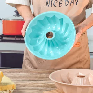 Silicone cake mold for baking, non-stick round swirling Bundt pan kitchen bakeware tool.