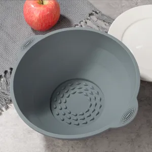 Detail shot of gray silicone bowl bottom texture and handle design for kitchen use.
