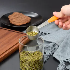 Stainless steel measuring spoon with orange silicone handle, 30ml kitchen baking tool.