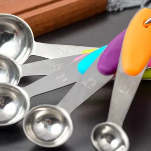 Stainless steel measuring spoons set with colorful silicone handles for baking cooking.