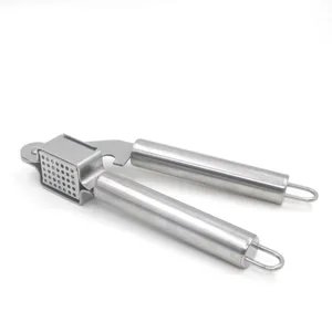 Stainless steel manual garlic press tool for kitchen use with hanging loop design