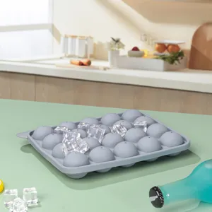 Silicone round ice cube tray close-up view, flexible material for easy kitchen use.