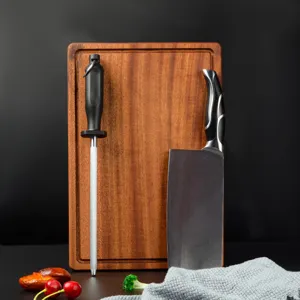Professional carbon steel kitchen knife sharpening rod with cutting board for home cooking.