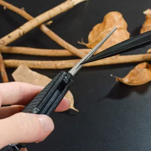 Portable mini diamond knife sharpener outdoor multi-tool fishing hook file with black handle.