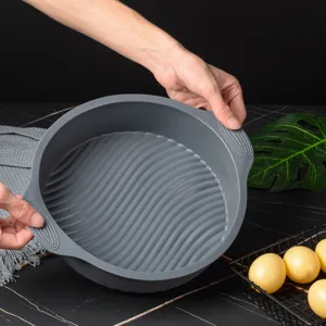 Detail view of a 9-inch round silicone cake mold with non-stick wavy bottom for DIY baking.