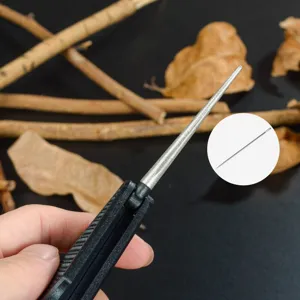 Portable diamond pocket sharpener and fishing hook file detail shot, ideal for outdoor camping.