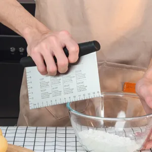 Stainless steel dough blender with measurement conversion chart, professional pastry cutter tool.