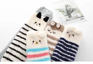 Cozy winter coral fleece fuzzy long socks for women with cute animal ears and striped patterns.