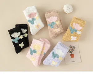 Cozy coral fleece winter sleep socks with cute tulip pattern, soft and warm mid-tube design.