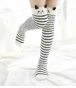 Cozy plush knee high socks with cute cat ears and warm coral fleece striped winter design.
