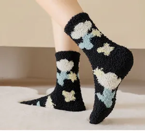 Cozy black coral fleece fuzzy socks with cute tulip pattern, soft and warm for winter home wear.