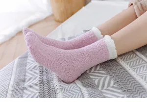 Cozy winter coral fleece fuzzy socks for women, thick plush sleep socks in pink.