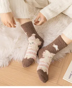 Cozy thick winter plush coral fleece socks close-up, featuring cute sleeping animal design.