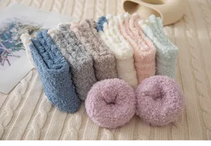 Thickened coral fleece warm mid-tube socks detail, cozy winter sleep socks soft texture.
