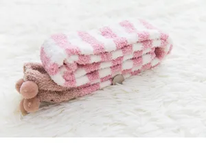 Cozy coral fleece striped calf socks detail shot, perfect warm sleep socks for women home wear.