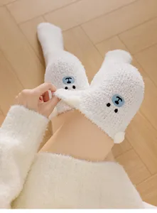 Cozy plush winter knee-high socks with cute 3D bear ears embroidery for women home sleep.