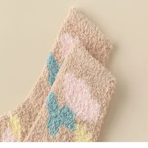 Winter coral fleece fuzzy socks featuring cute tulip patterns, soft and warm home sleep socks.