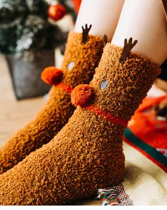 Cozy fluffy plush reindeer socks detail shot, soft fuzzy winter warm thermal home floor socks.