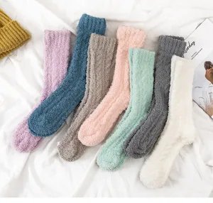 Detailed view of cozy coral fleece long socks in assorted colors, soft thickened winter sleep socks.
