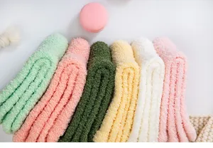 Detail view of thick winter coral fleece sleep socks, soft warm cozy solid colors.
