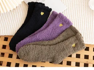 Cozy fuzzy coral fleece winter mid-calf socks for women, thick warm floor sleep socks detail view.