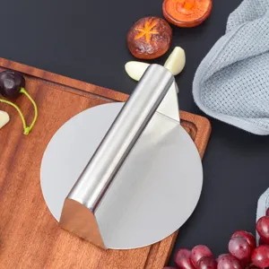 Stainless steel burger press detail, heavy duty meat press tool for kitchen cooking and teppanyaki.