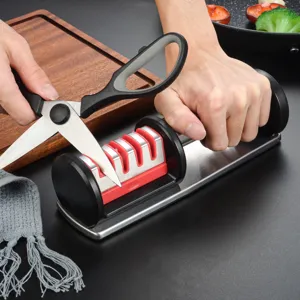 Four-stage manual kitchen knife sharpener with stainless steel base for home daily cooking use.