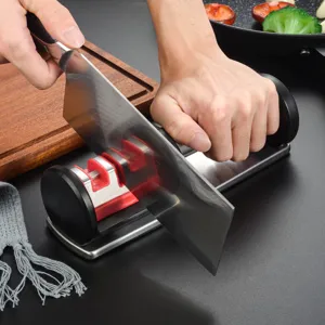 Multi-functional manual kitchen knife sharpener with multi-stage sharpening slots for home use.