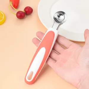 Stainless steel fruit melon baller spoon kitchen tool with a comfortable ergonomic handle.