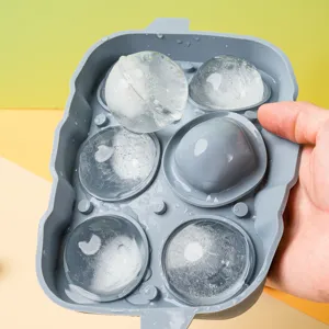 Silicone ice cube tray mold for whiskey and cocktails, flexible sphere maker for home kitchen use.