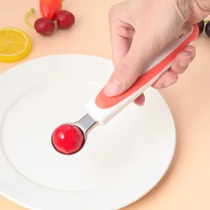 Stainless steel fruit melon baller spoon with comfortable handle for kitchen food carving use.