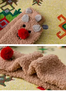 Coral fleece winter warm mid-tube socks with cute 3D ears and red ball detail, soft fuzzy texture.