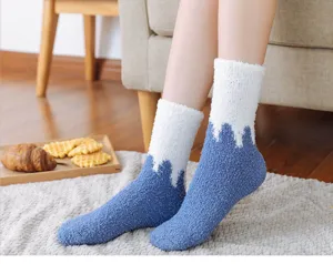 Cozy coral velvet fuzzy socks with snow mountain pattern, soft thickened winter sleep socks.
