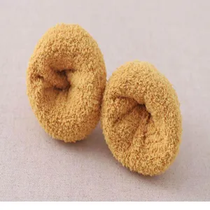 Coral fleece thick fuzzy home socks rolled detail view, warm winter sleep socks texture.