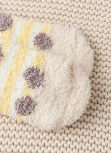 Cozy coral fleece winter fuzzy socks detail closeup, soft warm striped thermal sleep sock