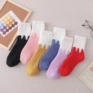 Thick coral fleece fuzzy winter sleep socks for women, cozy colorblock home socks.