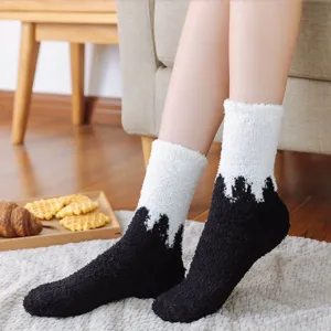Cozy coral fleece thick winter socks for women, black and white splicing home sleep socks.