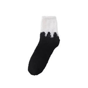 Thickened coral fleece women winter socks, black and white spliced warm sleep socks, main view.