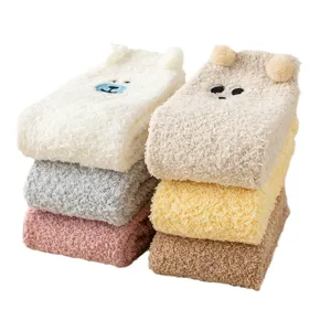 Cozy winter coral fleece fuzzy socks with cute bear embroidery and 3D ears for women.
