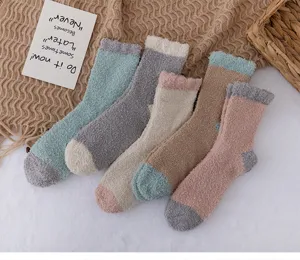 Cozy coral fleece socks detailed view, soft winter sleep socks with color block design for home.
