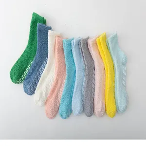 Winter thick coral fleece fuzzy socks with non-slip grip soles for cozy home sleep wear.