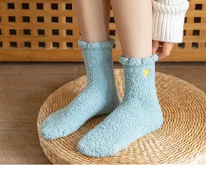 Women winter warm coral fleece mid-calf socks with cute heart embroidery and soft cozy fabric.