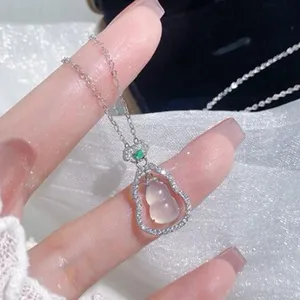 Exquisite silver diamond hollow gourd pendant necklace, elegant chalcedony detail close-up.