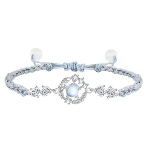 Blue woven rope bracelet with cubic zirconia and moon pendant, adjustable fashion jewelry for women