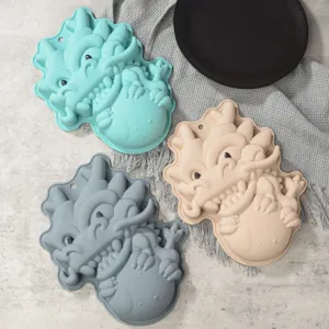 Detailed view of creative cartoon dragon silicone cake molds, non-stick DIY baking trays.