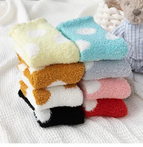 Cozy coral fleece women socks in vibrant colors with polka dots, soft and warm for winter home wear.
