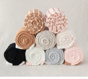 Cozy coral fleece fuzzy winter socks for women, thick warm sleep socks stacked neatly.