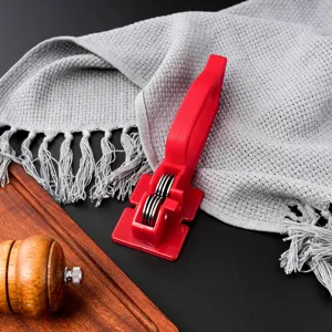 Kitchen knife sharpener detail view, stainless steel grinding wheels, household tool.